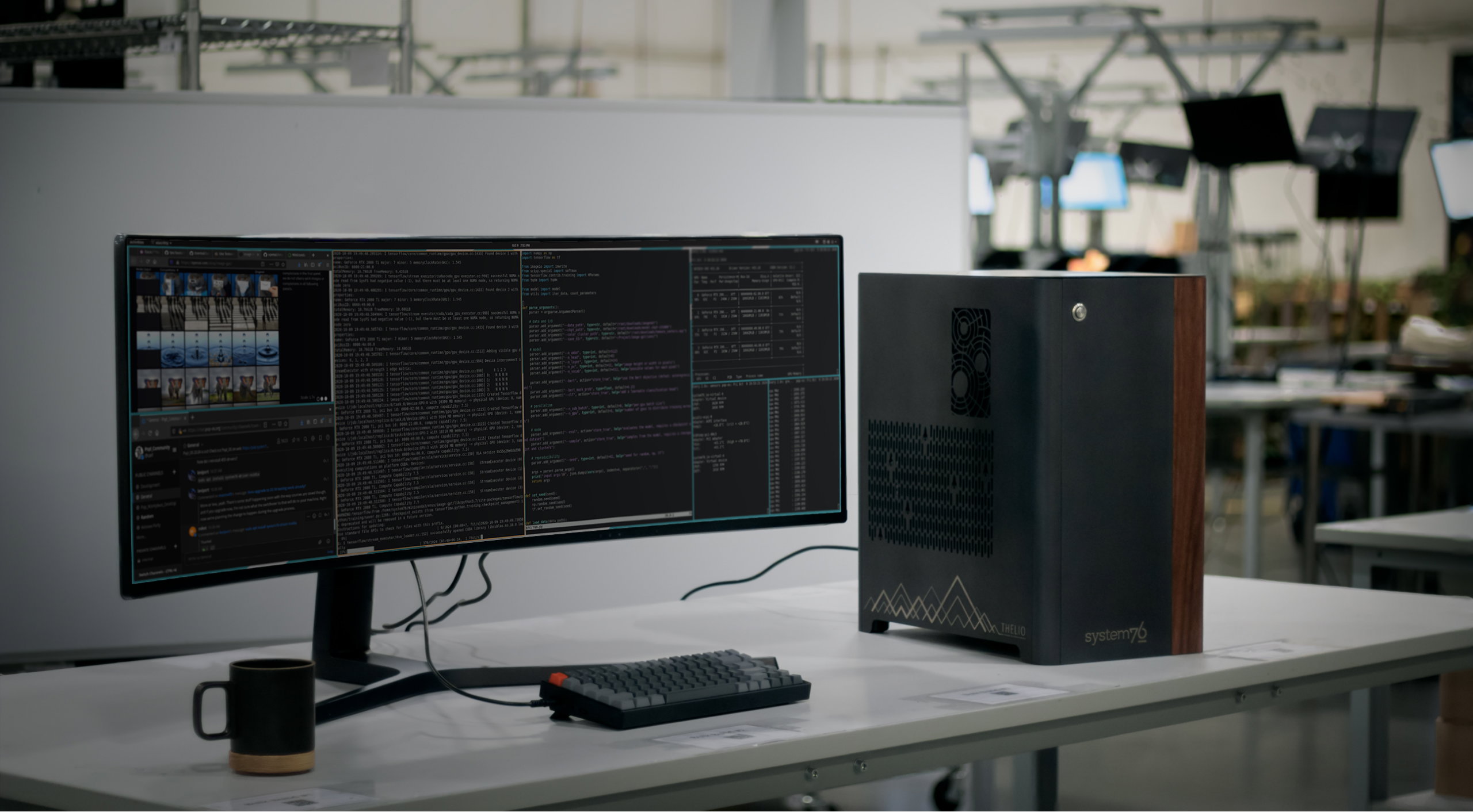 Desk setup with Thelio Mega, ultrawide monitor, keyboard and a coffee mug.