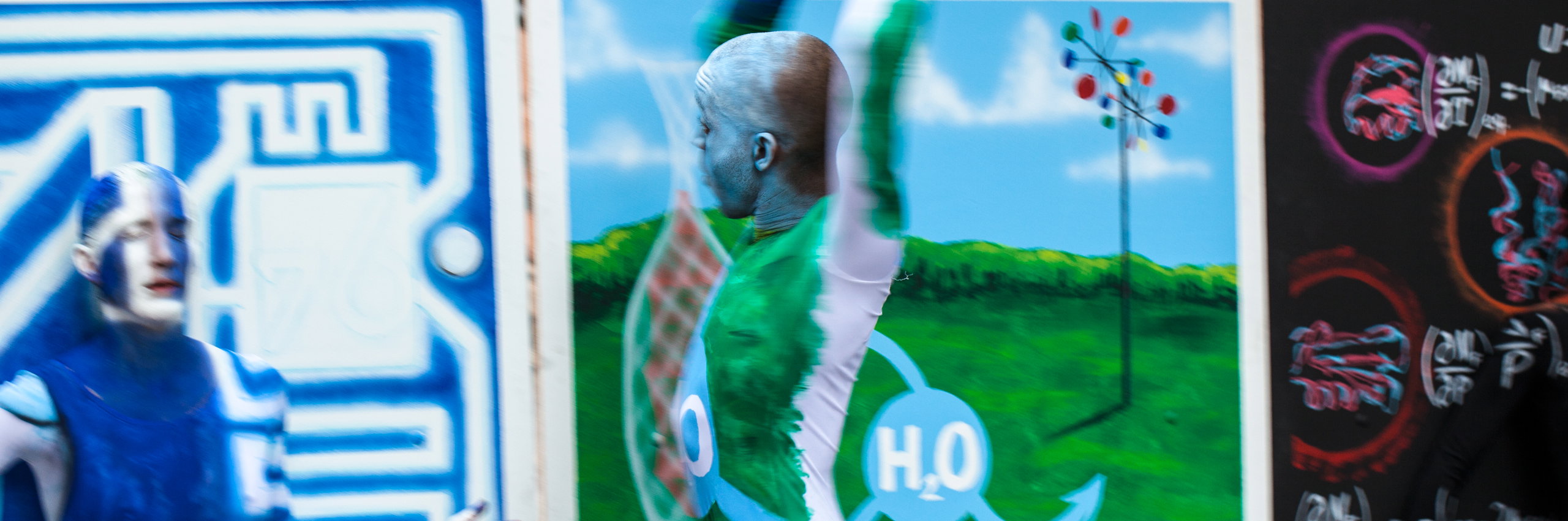 Engineering dancer with hands above head in excitement