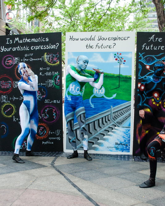 Painted Engineering dancer freestyle dancing in front of the 'How you woud engineer the future?' panel