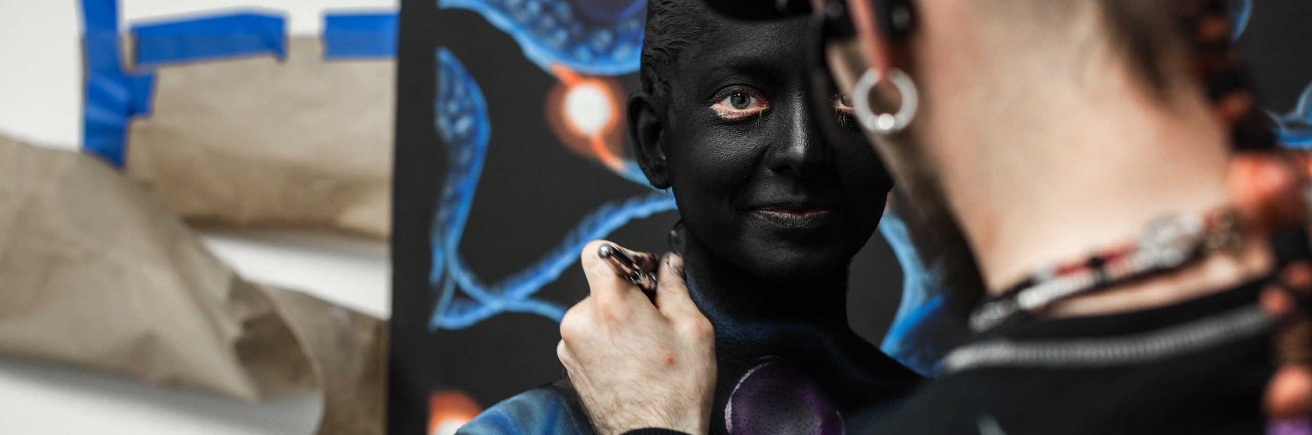 Dancer being painted for the STEM event