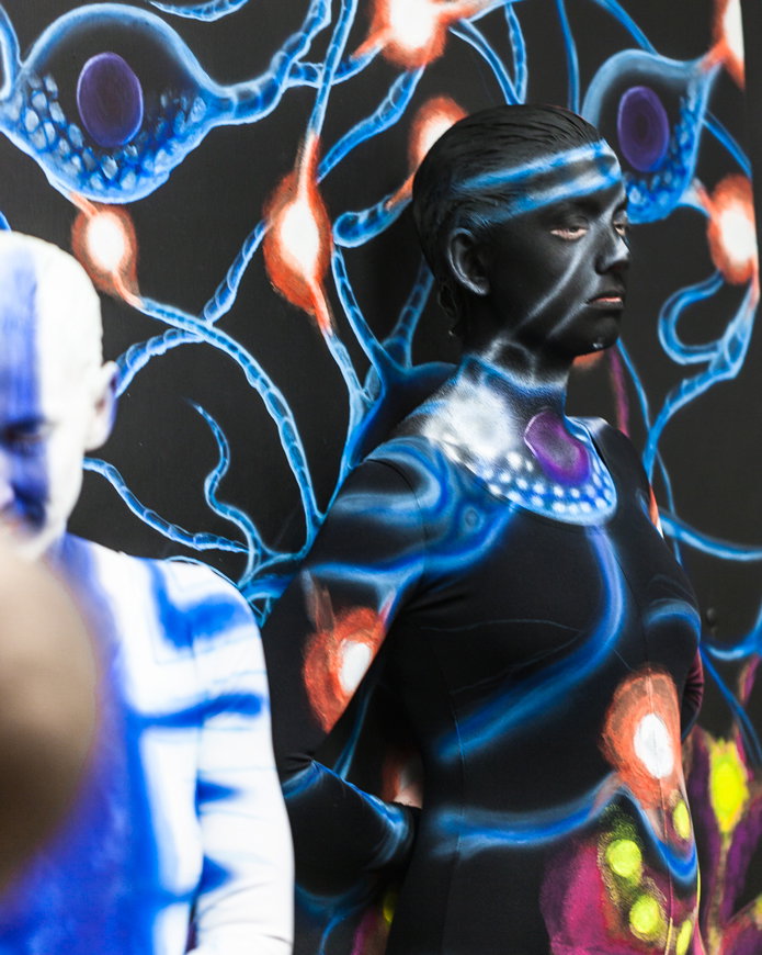 Side view of the dancer blending into the Science panel