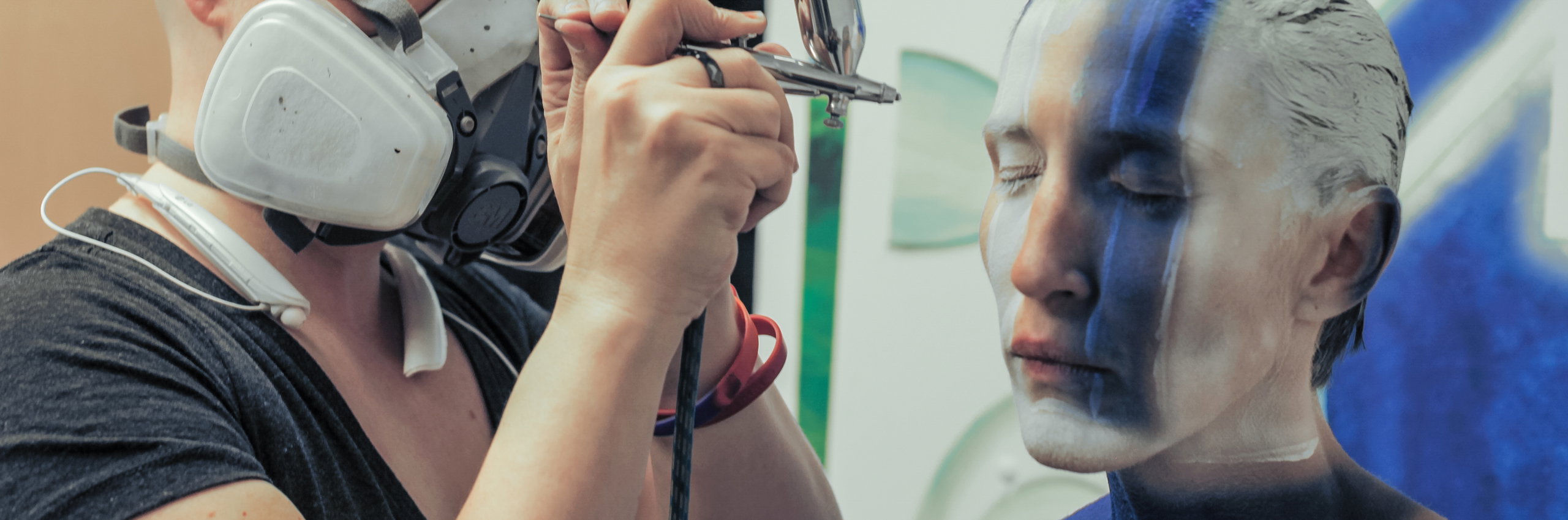 Technology dancer getting her face painted
